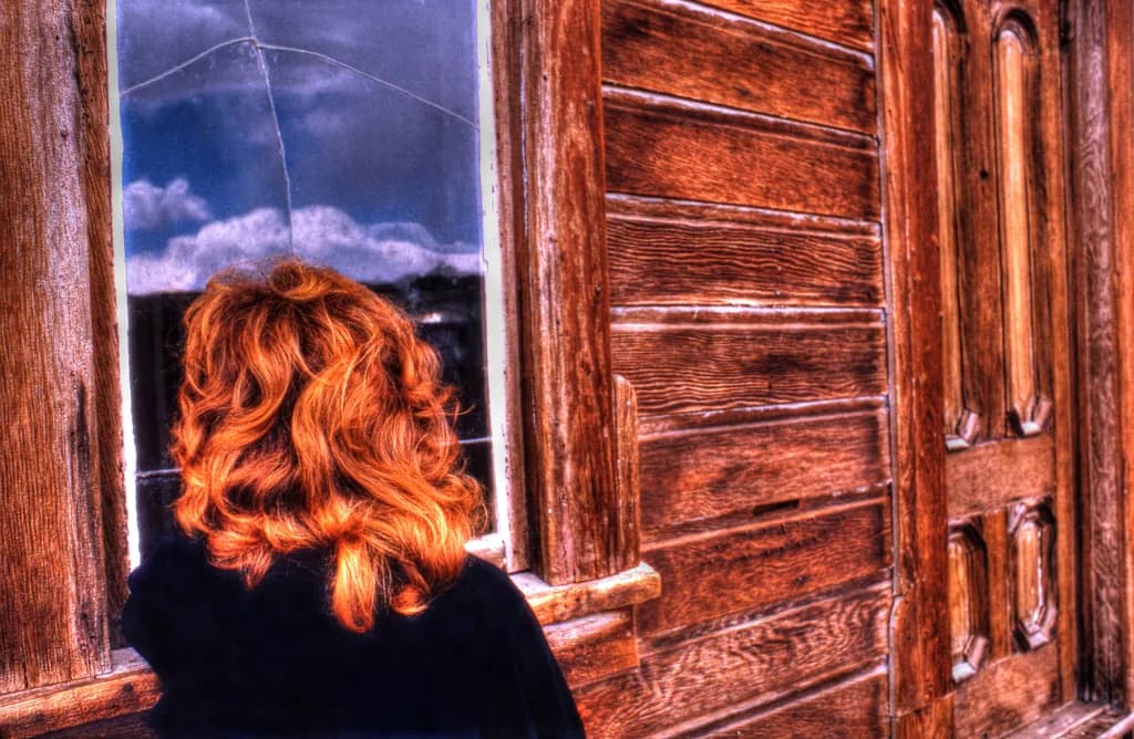 Whispers of Reflection: A Woman's Solitude by the Window
