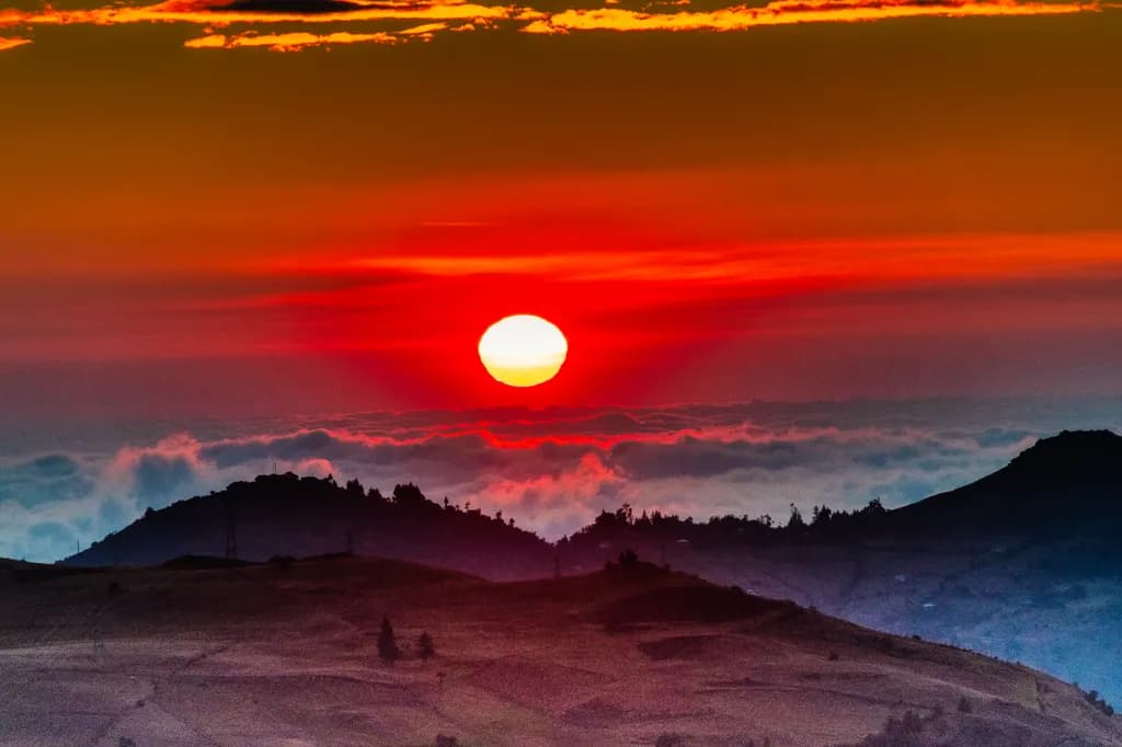 Ethereal Sunset Over Misty Mountains: A Serene Landscape Experience