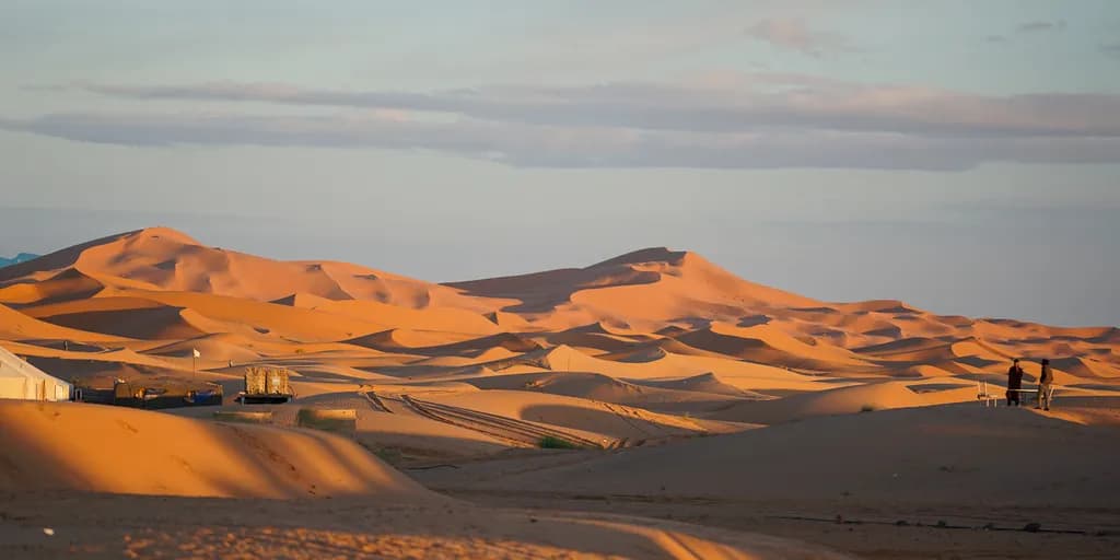 Whispers of the Desert: A Serene Landscape of Expansive Dunes at Dusk