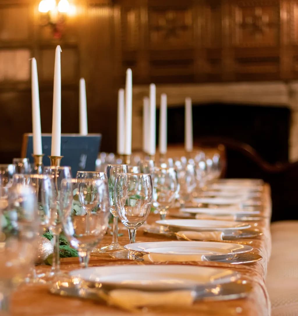 Elegant Candlelit Dinner Table Setting with Glassware and Fine China