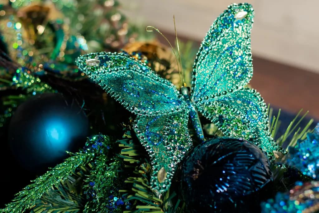 Whimsical Elegance: A Sparkling Blue Butterfly Adorning Festive Greens