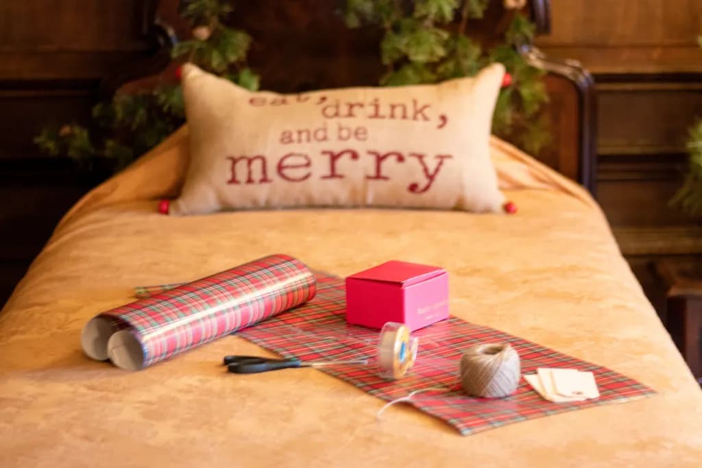 Festive Wrapping Essentials: A Cozy Holiday Scene with Cheerful Decor and Gift Preparation Tools