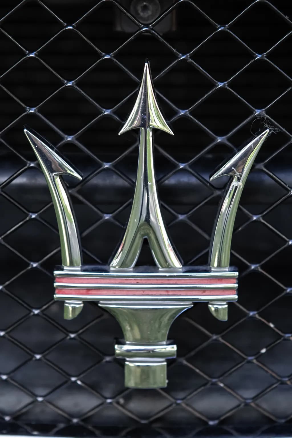 Emblem of Elegance: The Iconic Chrome Design of Luxury Automotive Artistry