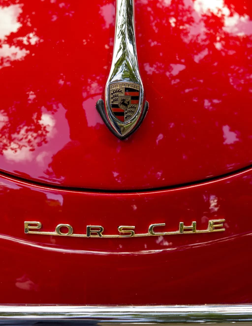 Classic Elegance: The Allure of a Red Porsche Emblem