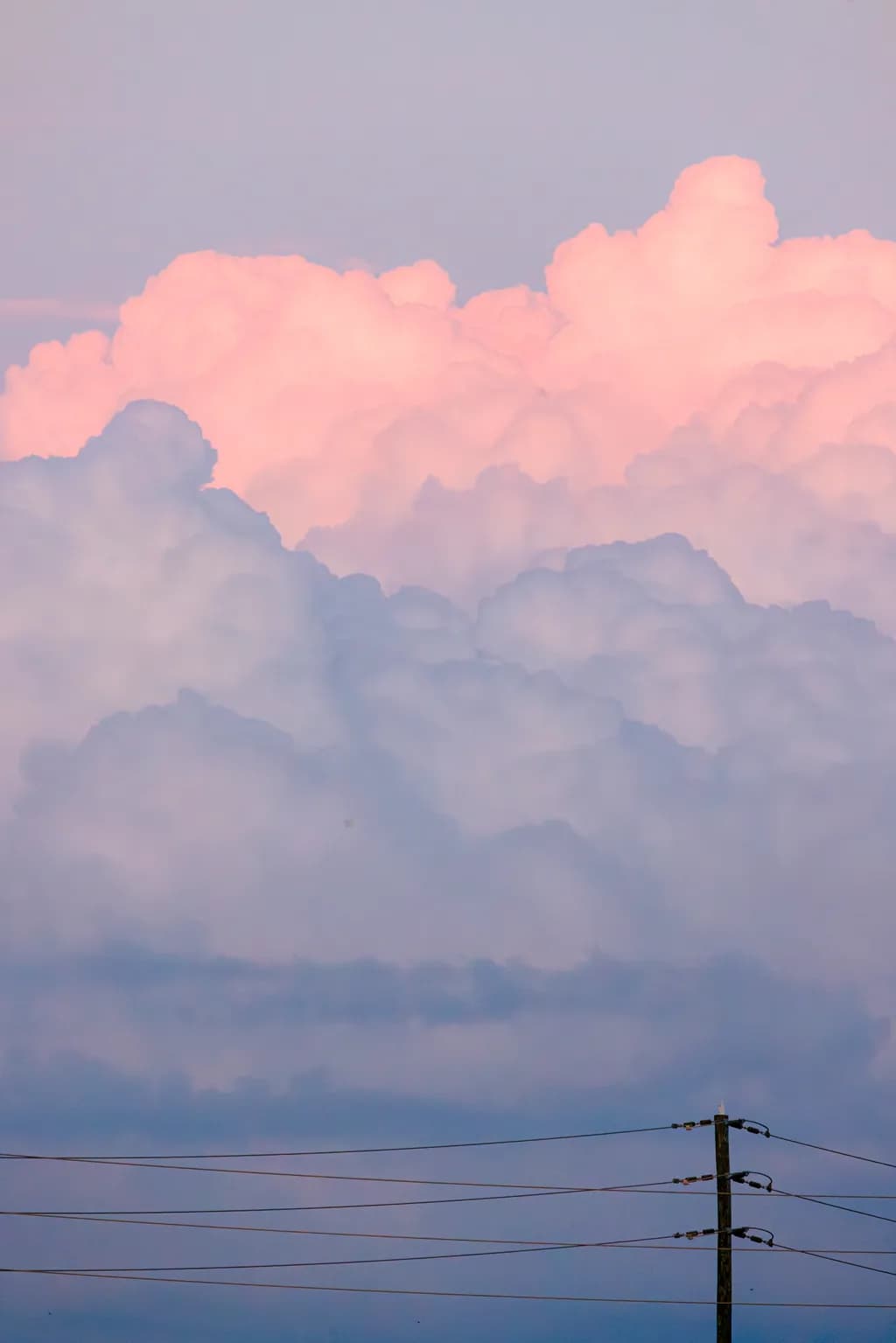 Whispers of the Sky: A Serene Dance of Clouds at Dusk