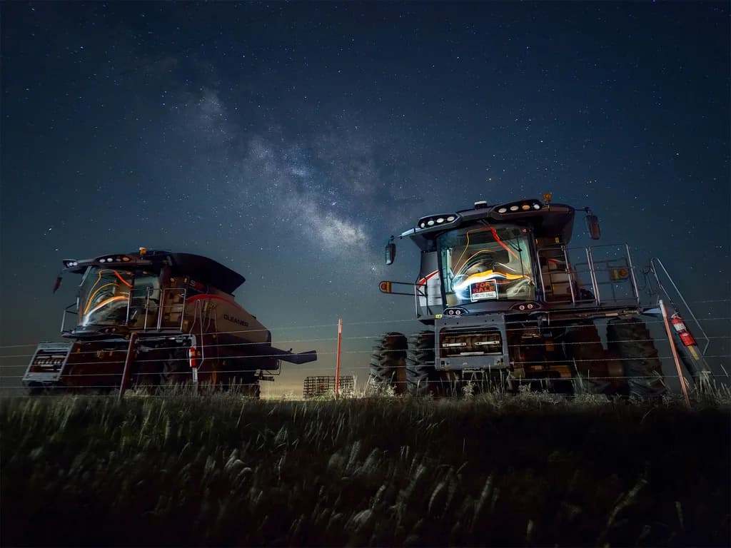 Two Combines Passing in the Night
