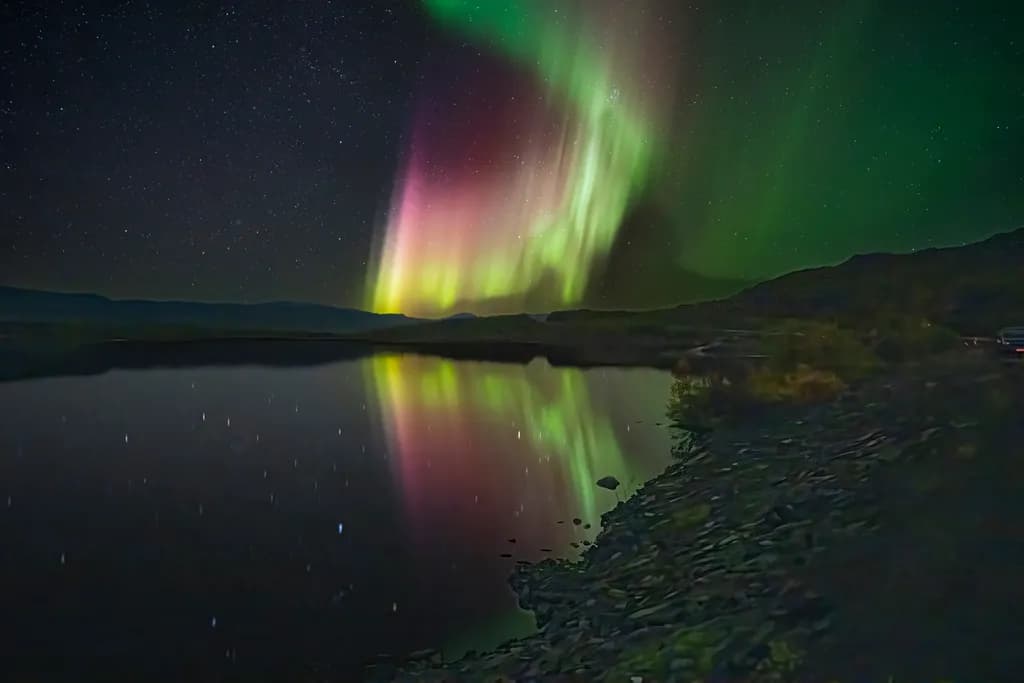 Whispers of the Aurora: A Serene Night Reflection Under the Stars