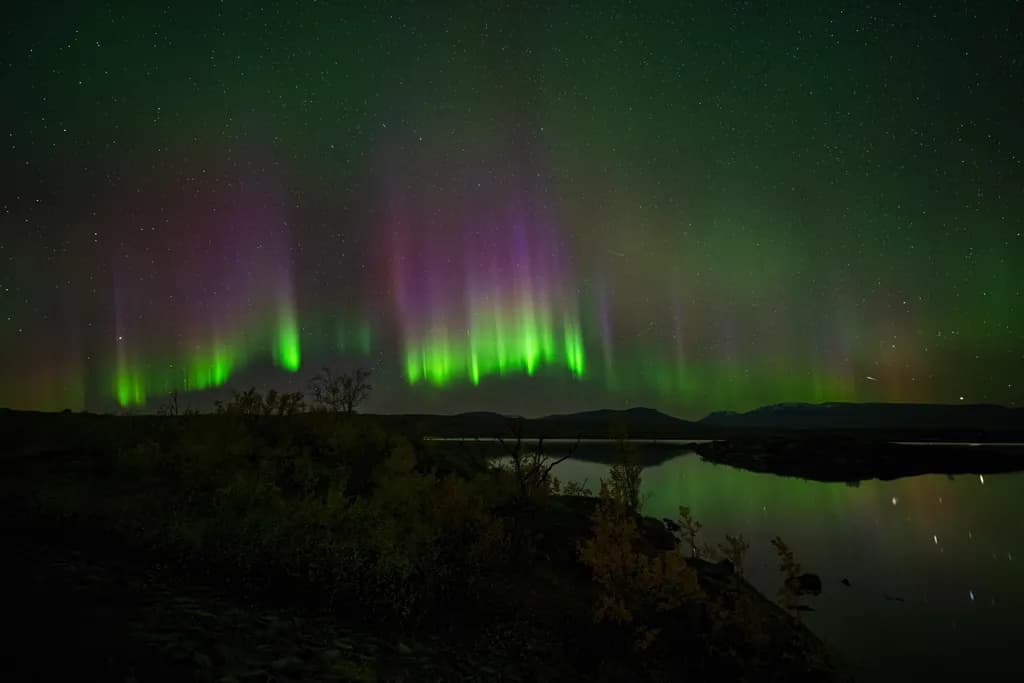 Whispers of the Aurora: A Dance of Light and Shadow in the Night Sky