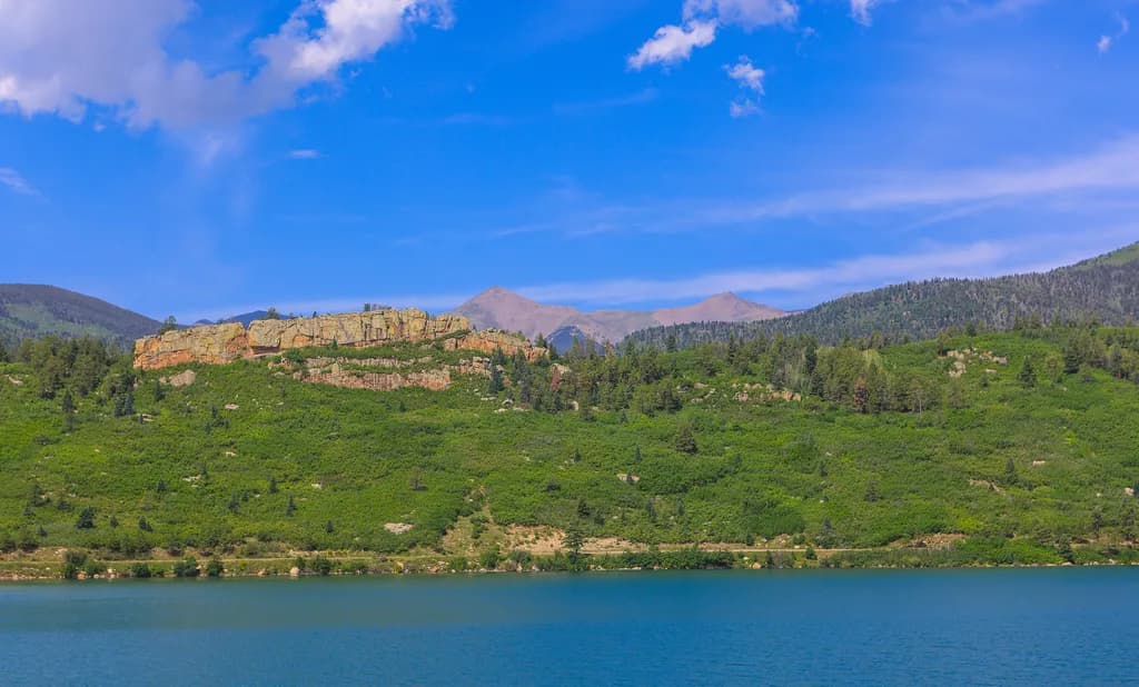 Whispers of Nature: A Serene Lakeside Escape in Vibrant Greens and Blues