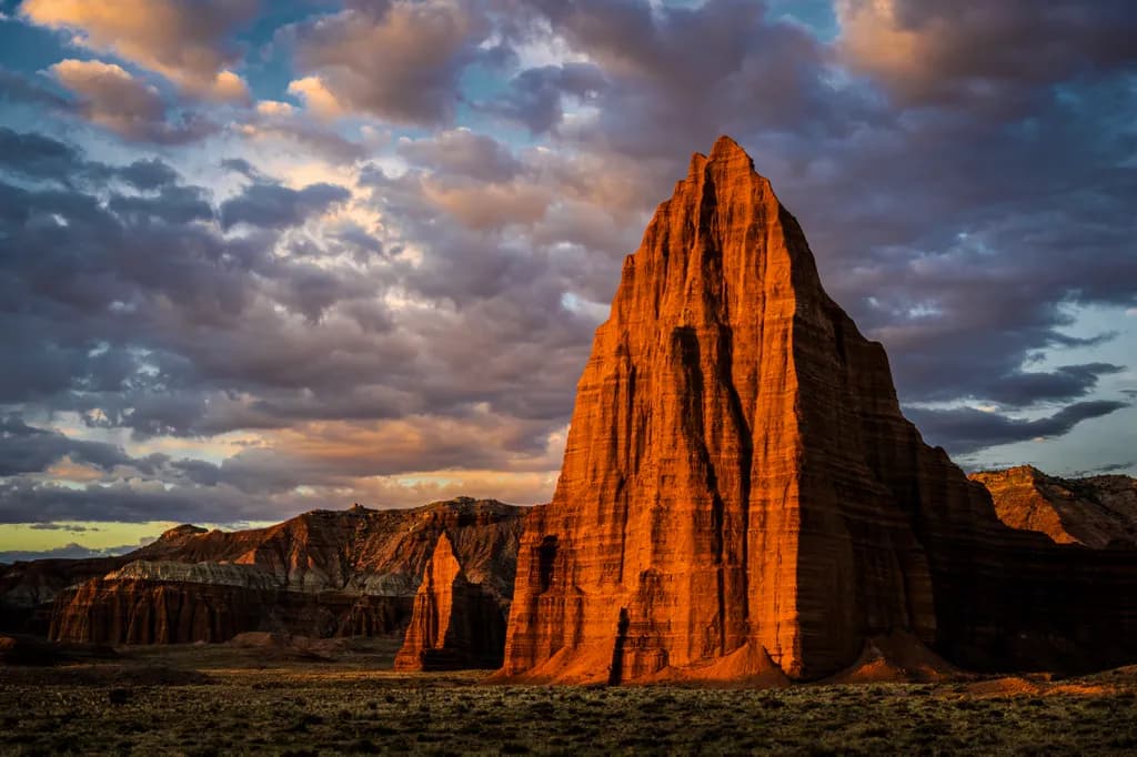 Majestic Peaks: The Golden Hour Embrace of Nature's Sculpted Masterpiece