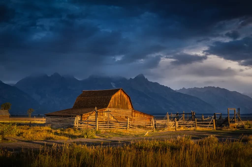 Whispers of the Old Barn: A Serene Evening in the Shadow of the Mountains