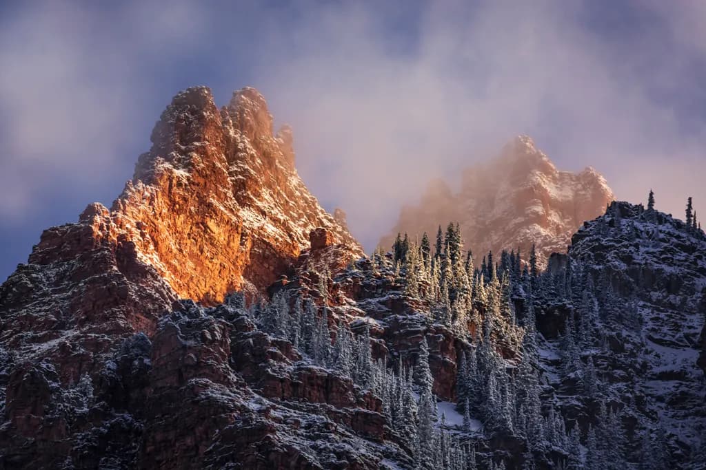 Majestic Peaks: A Dance of Light and Shadow in Winter's Embrace