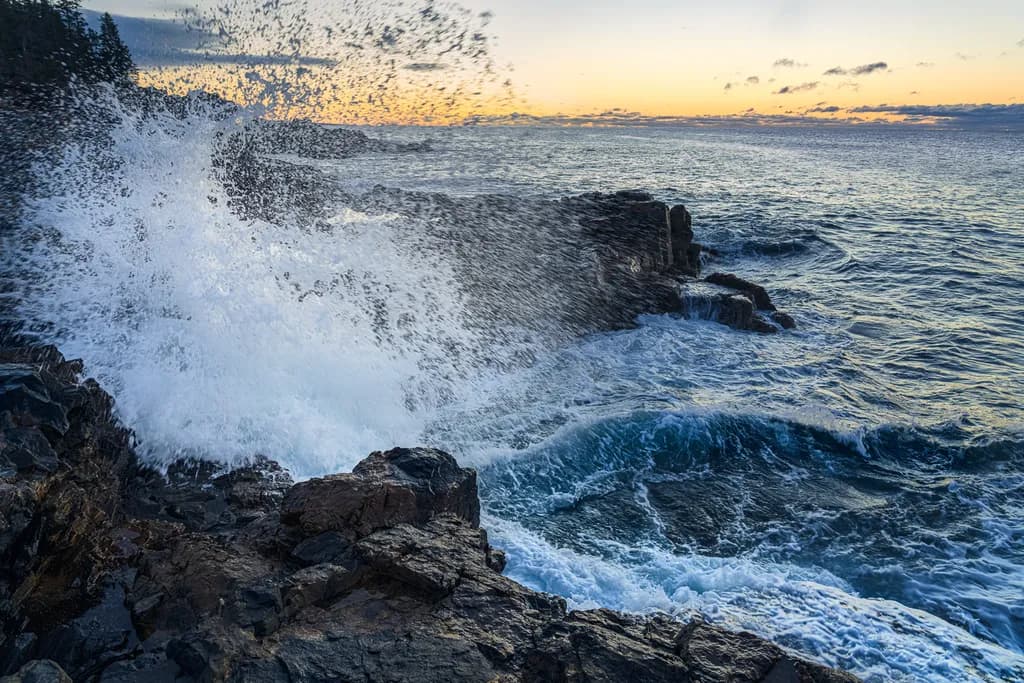 Ocean's Embrace: A Dance of Waves and Rocks at Dusk