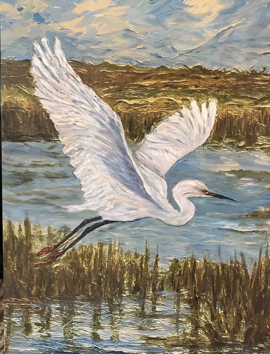 Graceful Flight: A Serene Egret Soars Over Tranquil Waters at Dusk