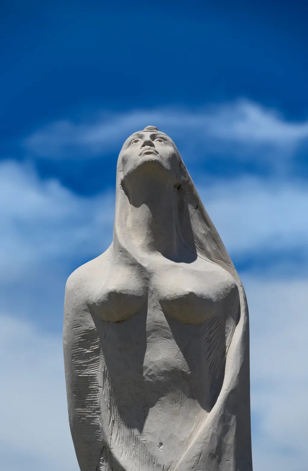 Embracing the Sky: A Serene Sculpture of Hope and Strength