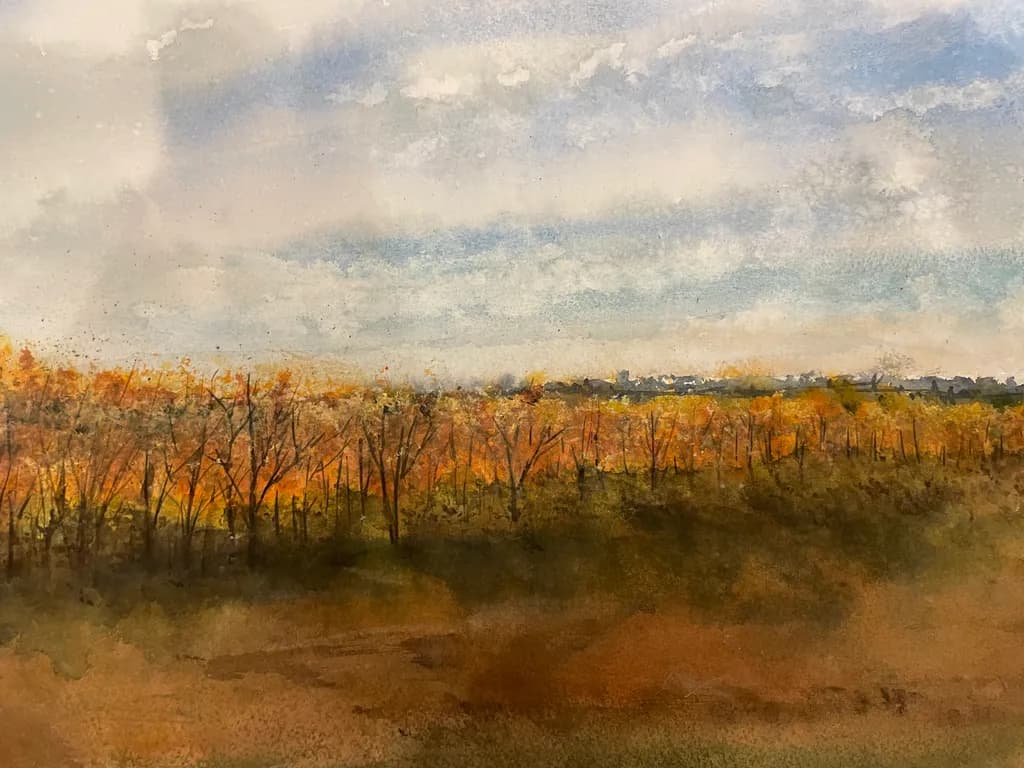 Autumn's Embrace: A Serene Landscape of Golden Hues and Gentle Skies