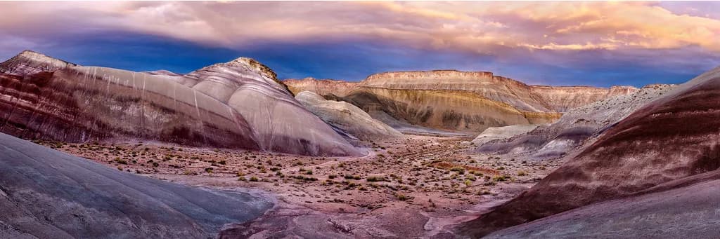 Desert Symphony: A Vibrant Panorama of Rocky Landscapes and Colorful Skies