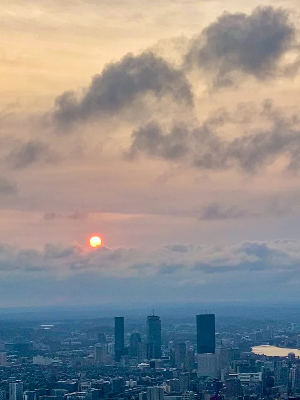 Serene Sunset Over Urban Skyline: A Tranquil Evening in the City