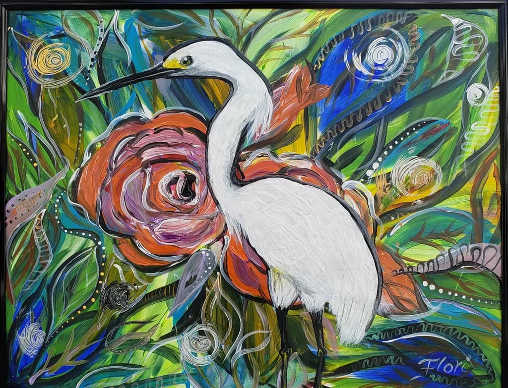 Whispers of Nature: A Serene Egret Amidst Vibrant Blooms and Lush Foliage