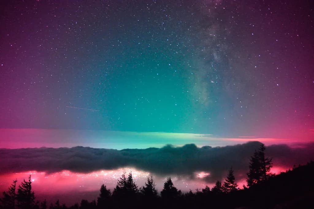 Celestial Dreams: A Vibrant Night Sky Over Whispering Clouds