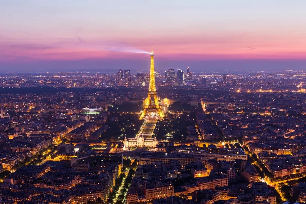 Eiffel Tower Illuminated: A Twilight Embrace of Parisian Splendor