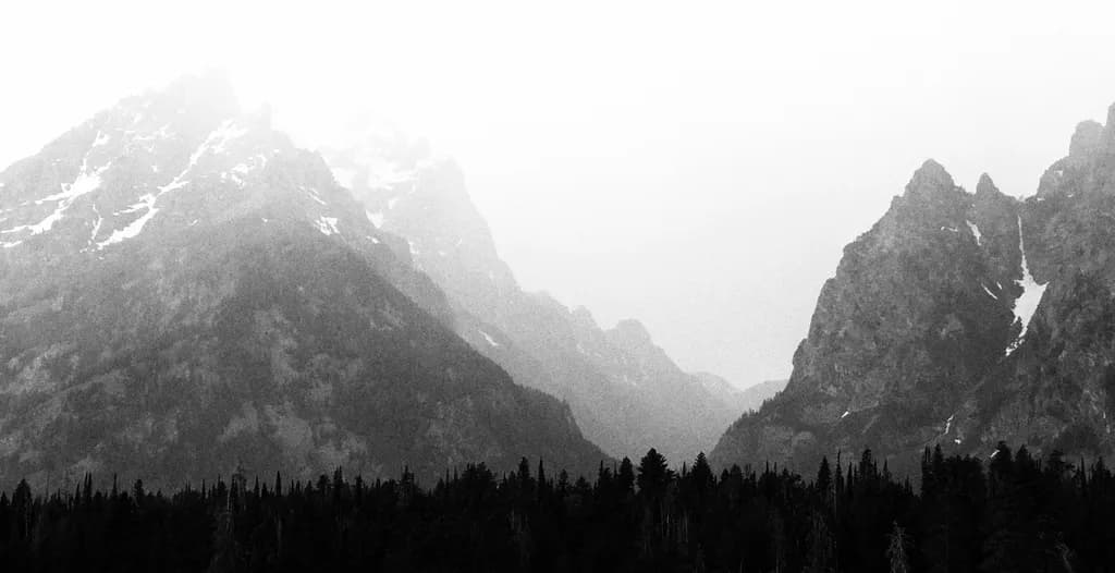 Whispers of the Mountains: A Monochrome Journey Through Mist and Majesty