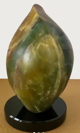NATURAL EMBRACE: Green Stone Sculpture Set on a Black Granite Base, Symbolizing Unity and Transformation, 12 x 6 inches