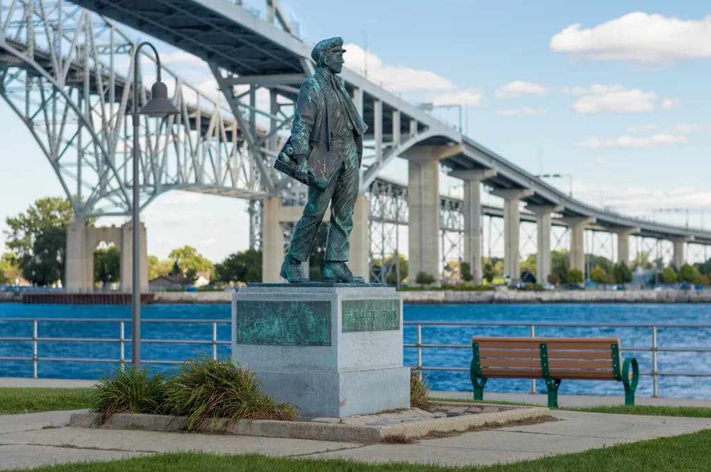 A Stroll Through Time: The Iconic Figure Beneath the Bridge