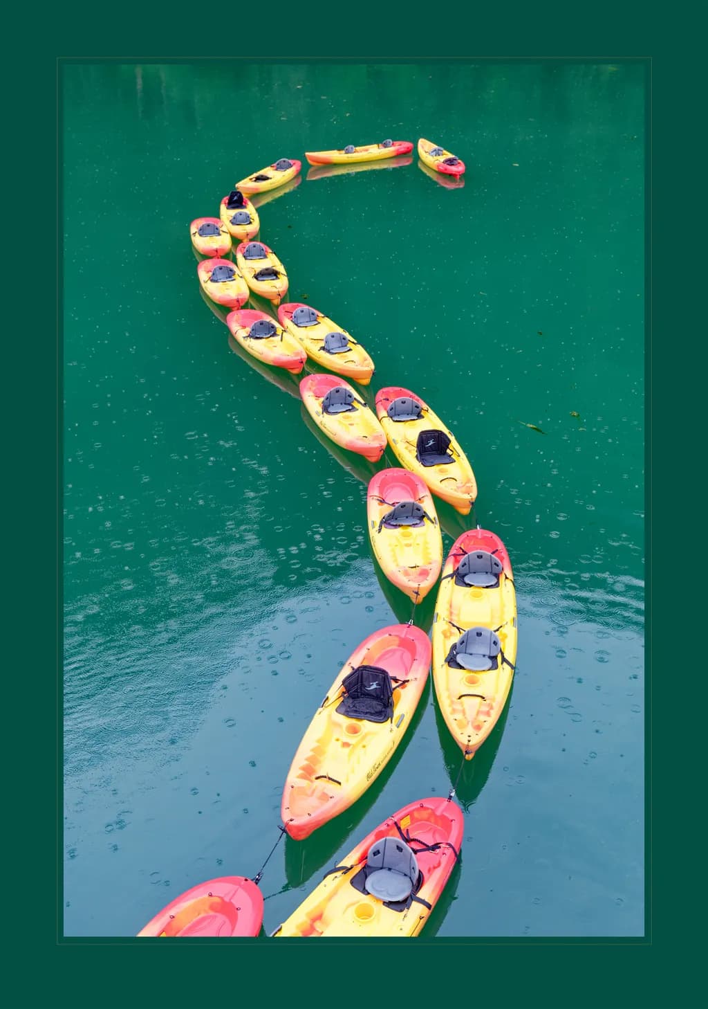 Serpentine Serenity: A Kaleidoscope of Kayaks on Tranquil Waters