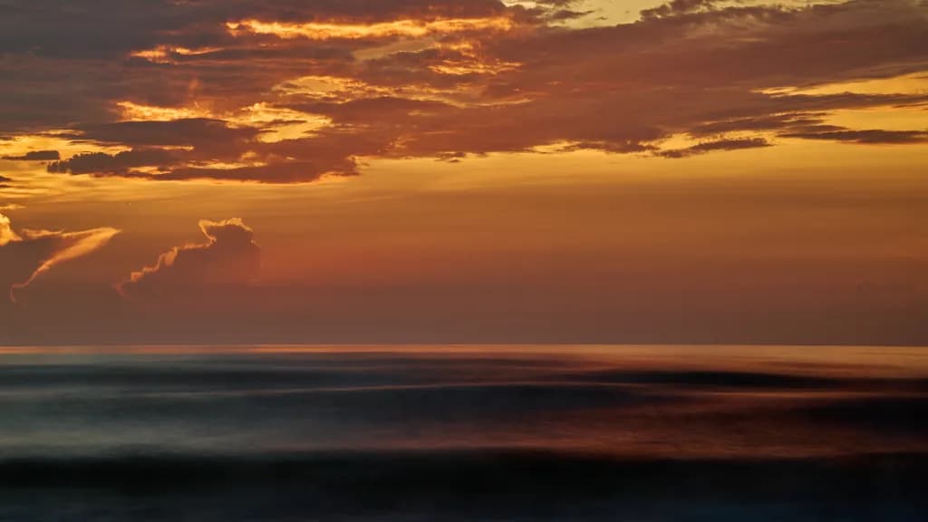 Serenity at Sunset: A Tranquil Dance of Colors Over the Sea