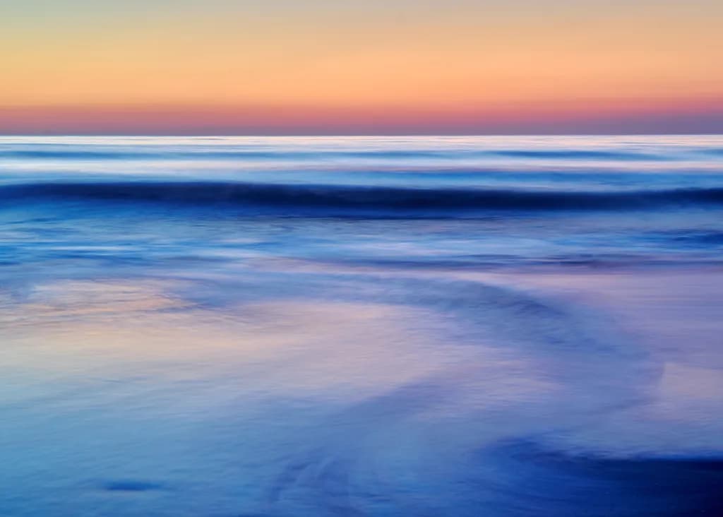 Whispers of the Ocean: A Serene Sunset Reflection
