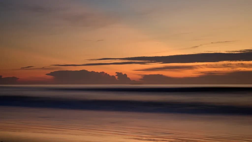 Serenity at Dusk: A Tranquil Sunset Over Calm Waters