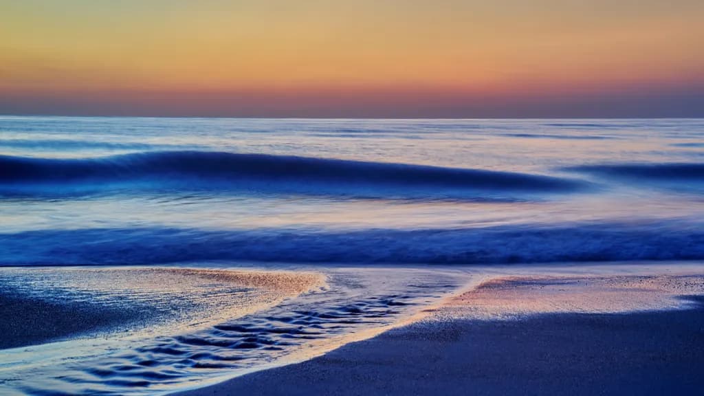 Whispers of the Ocean: A Serene Sunset Over Gentle Waves