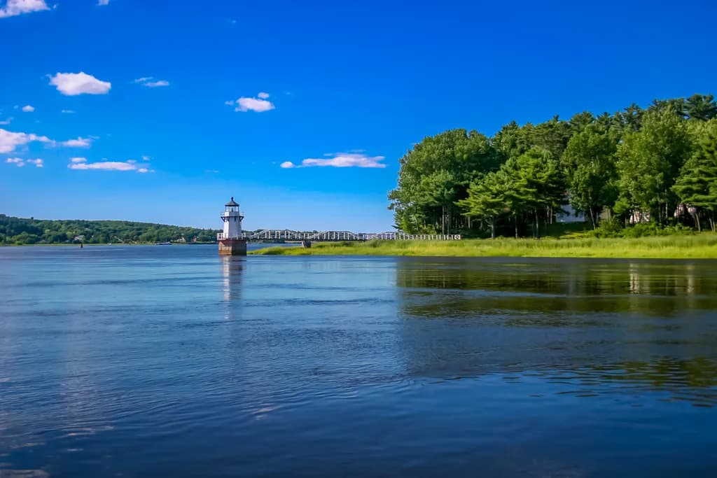 Whispers of Tranquility: A Lighthouse Reflection on Serene Waters