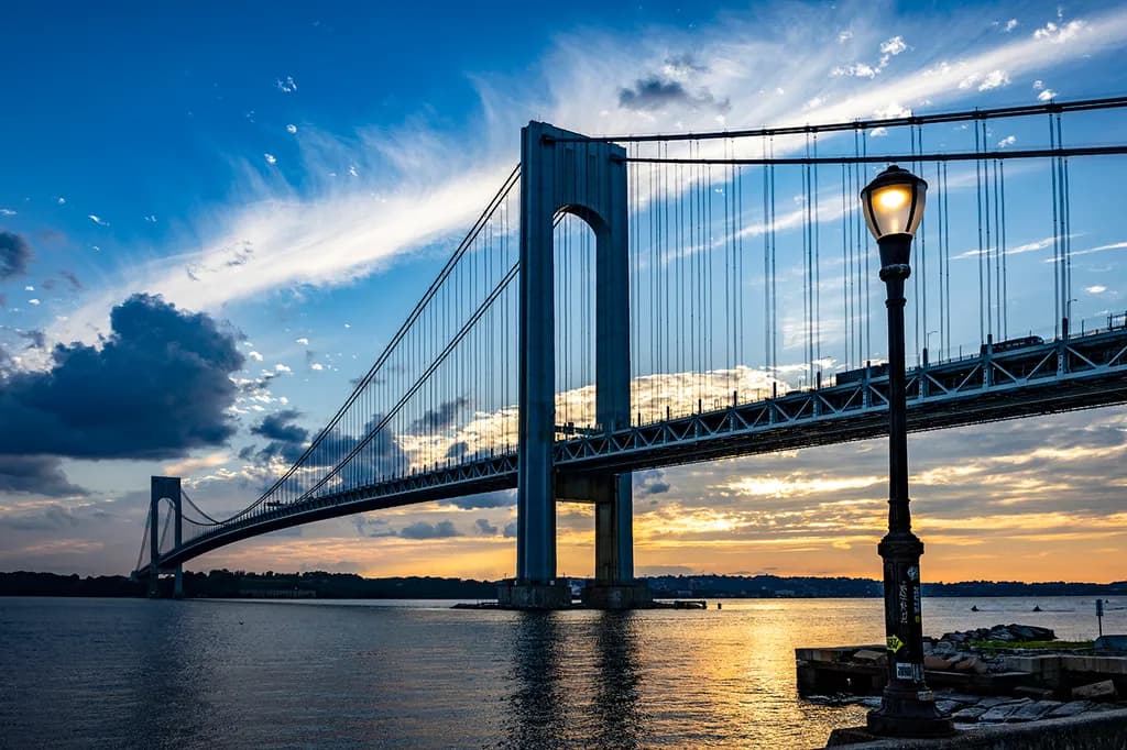 Bridging Horizons: A Serene Sunset Over the Waterway