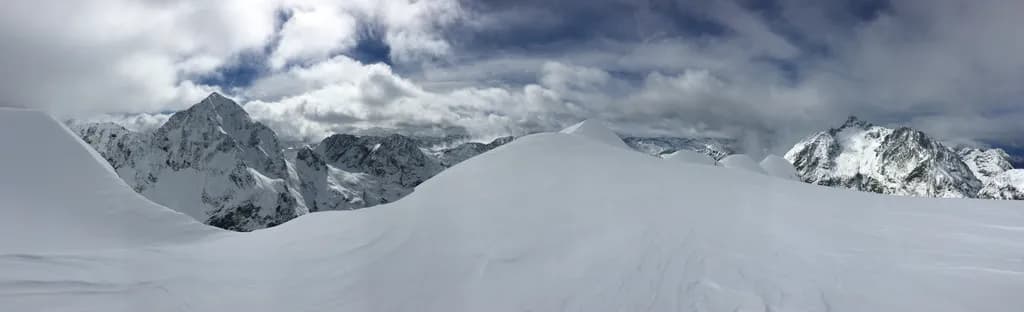 Whispers of Winter: A Majestic Snow-Capped Panorama of the Alpine Peaks