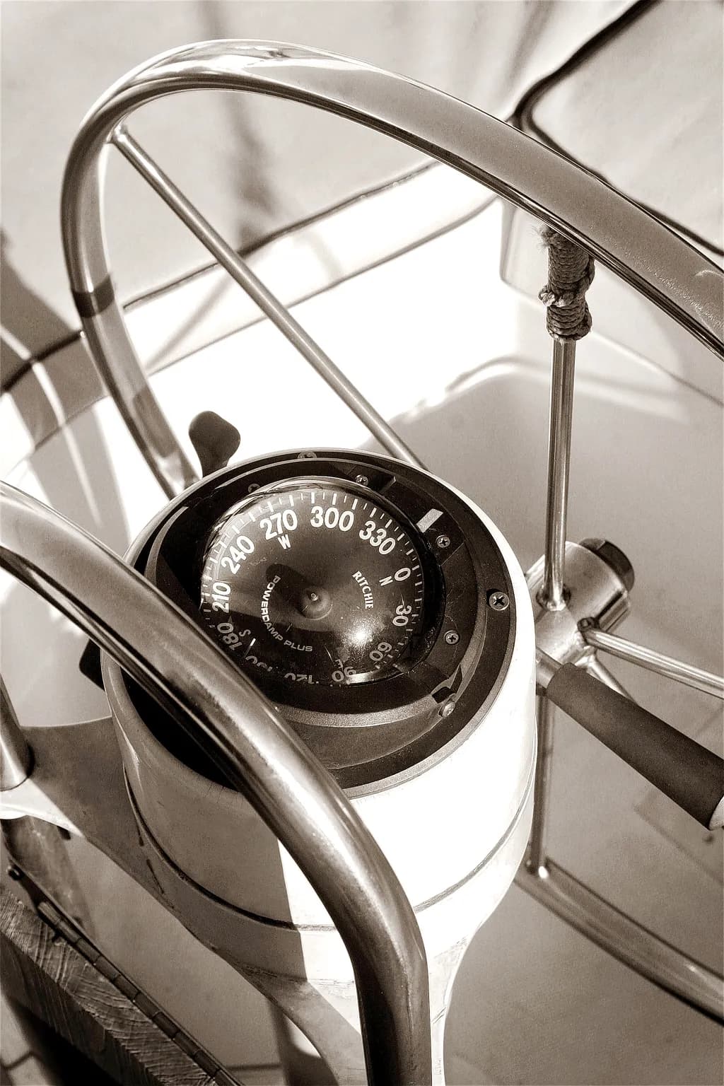 Navigating Time: A Vintage Compass and Steering Wheel Journey