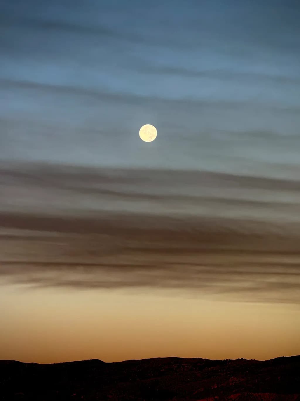 Moonlit Serenity: A Tranquil Evening Sky Over Rolling Hills