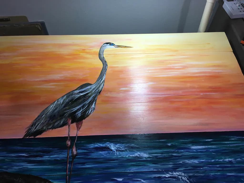 Serenity at Sunset: A Majestic Heron Stands by the Ocean's Edge
