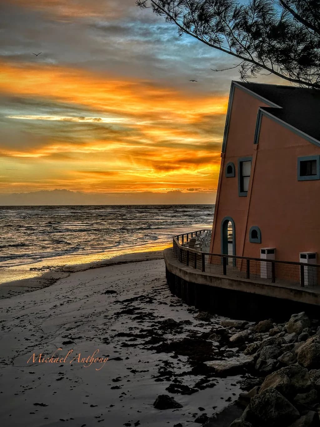 Serene Sunset Over Coastal Architecture: A Tranquil Evening by the Shore