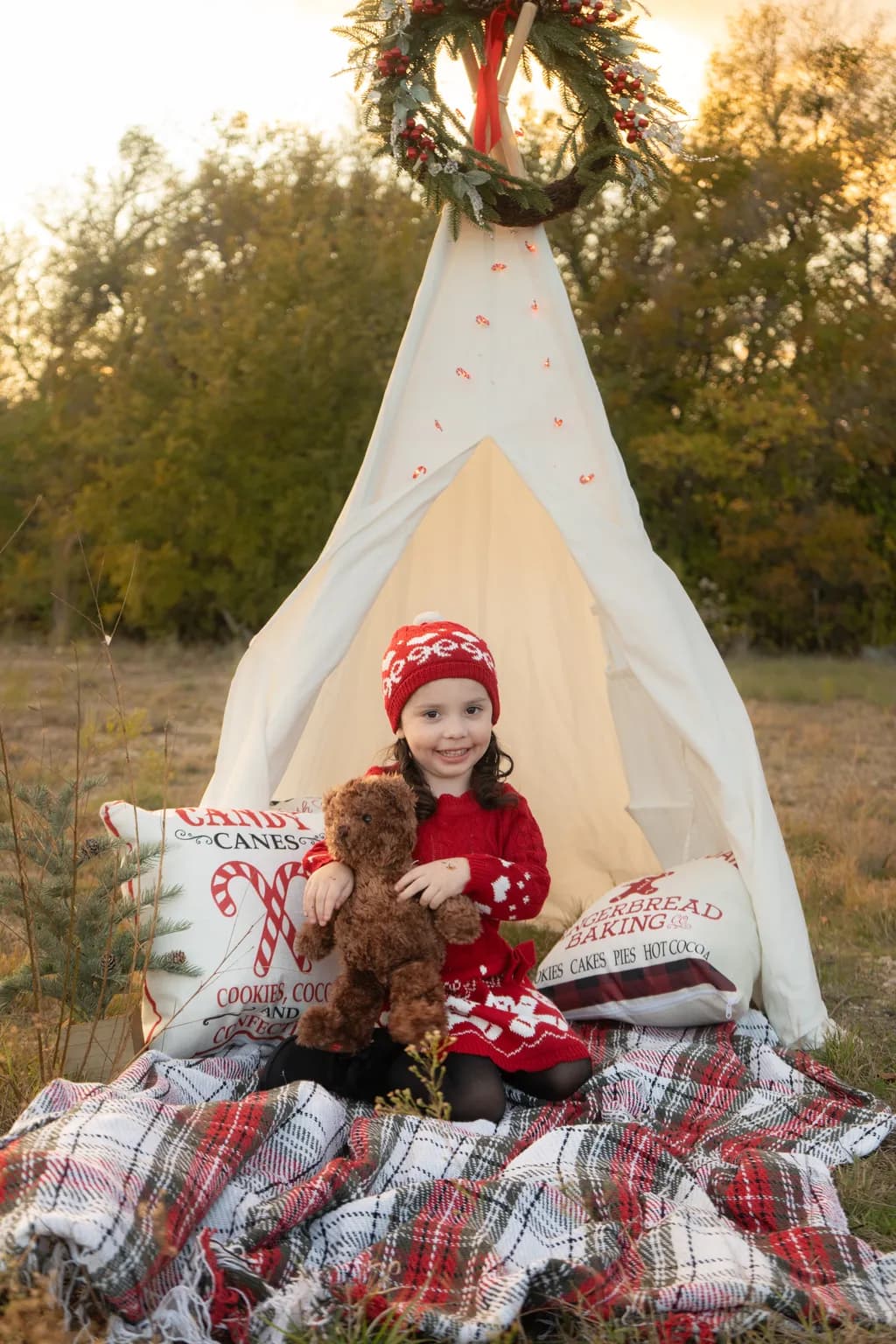 Whimsical Winter Wonderland: A Cozy Holiday Scene with a Little Girl and Her Teddy Bear