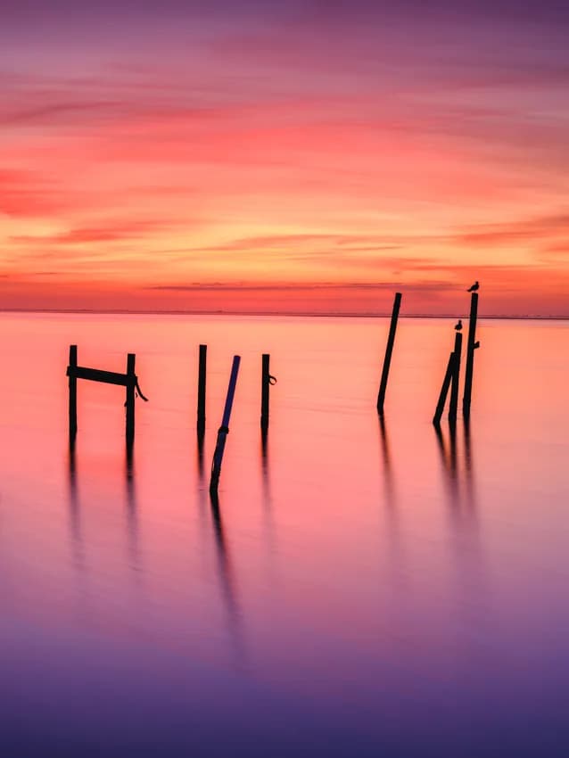 Whispers of Twilight: A Serene Sunset Reflection Over Water