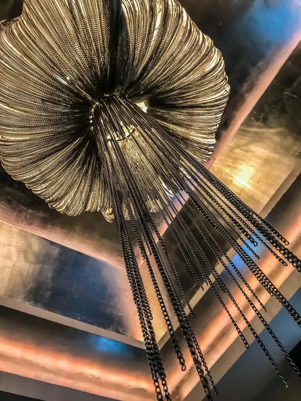 Celestial Cascade: A Dazzling Chandelier of Light and Shadow
