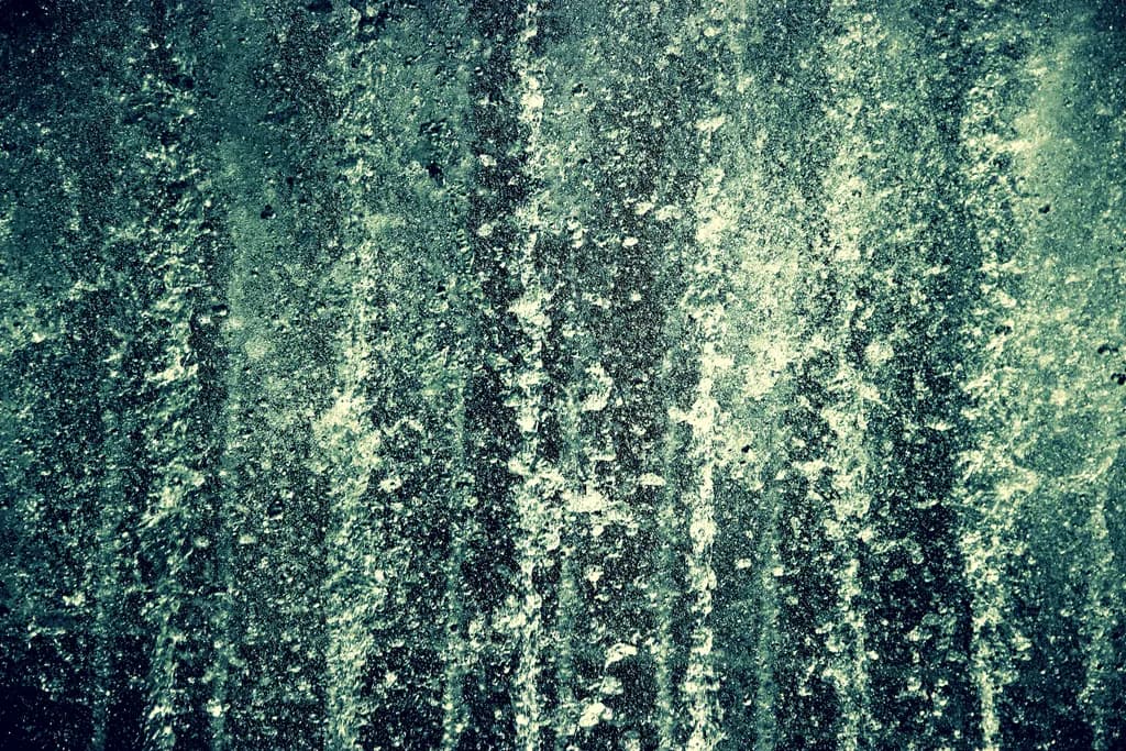 Fluid Harmony: An Abstract Exploration of Green Water Textures