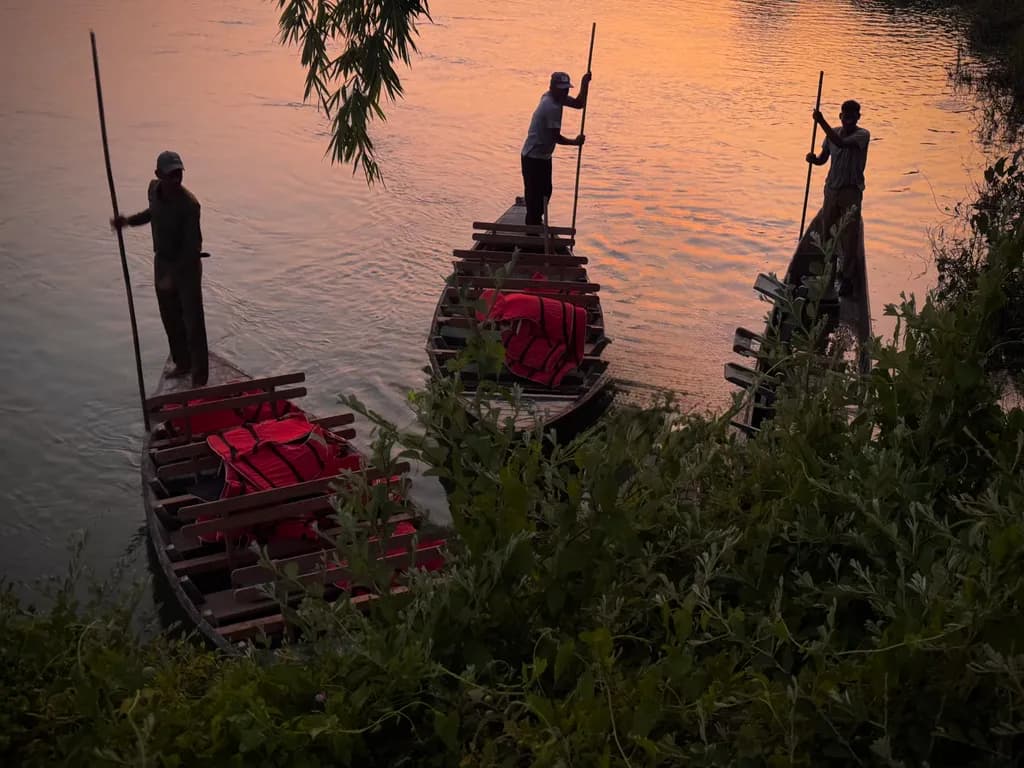 Evening Serenity: Fishermen Navigating Tranquil Waters at Dusk