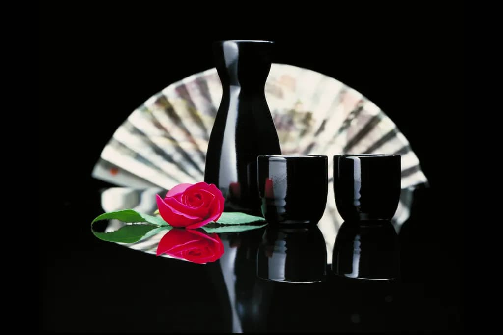 Elegant Harmony: A Still Life of Tradition and Beauty with Black Ceramics and a Rose