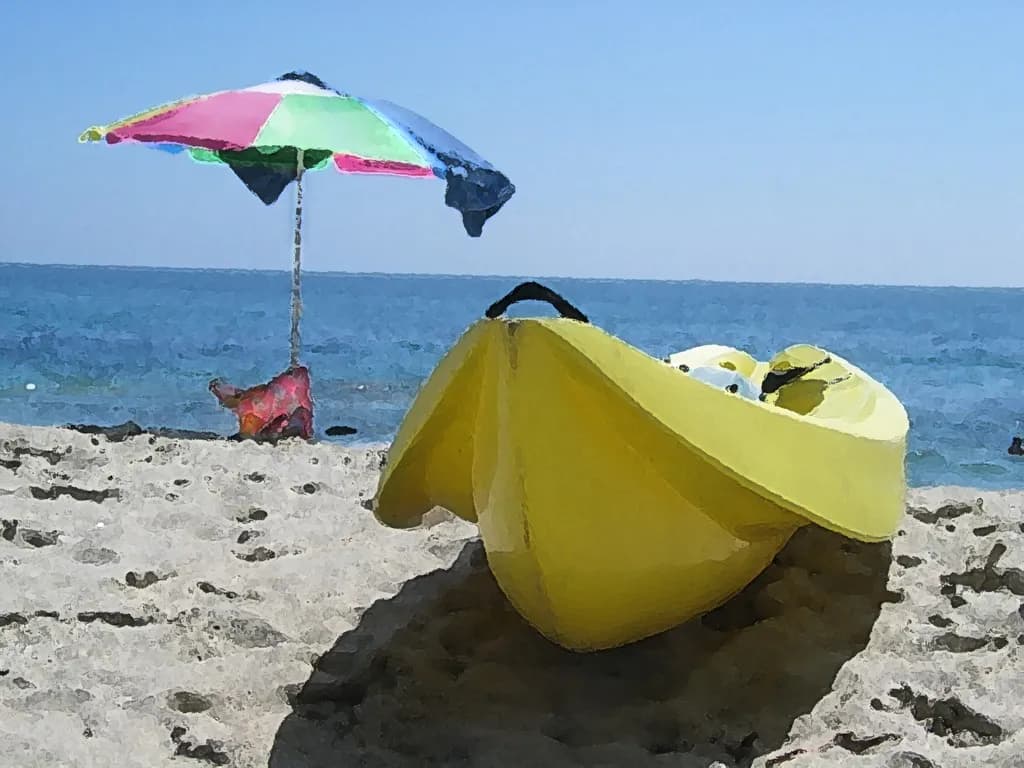 Sun-Kissed Serenity: A Vibrant Kayak by the Ocean Under a Colorful Umbrella