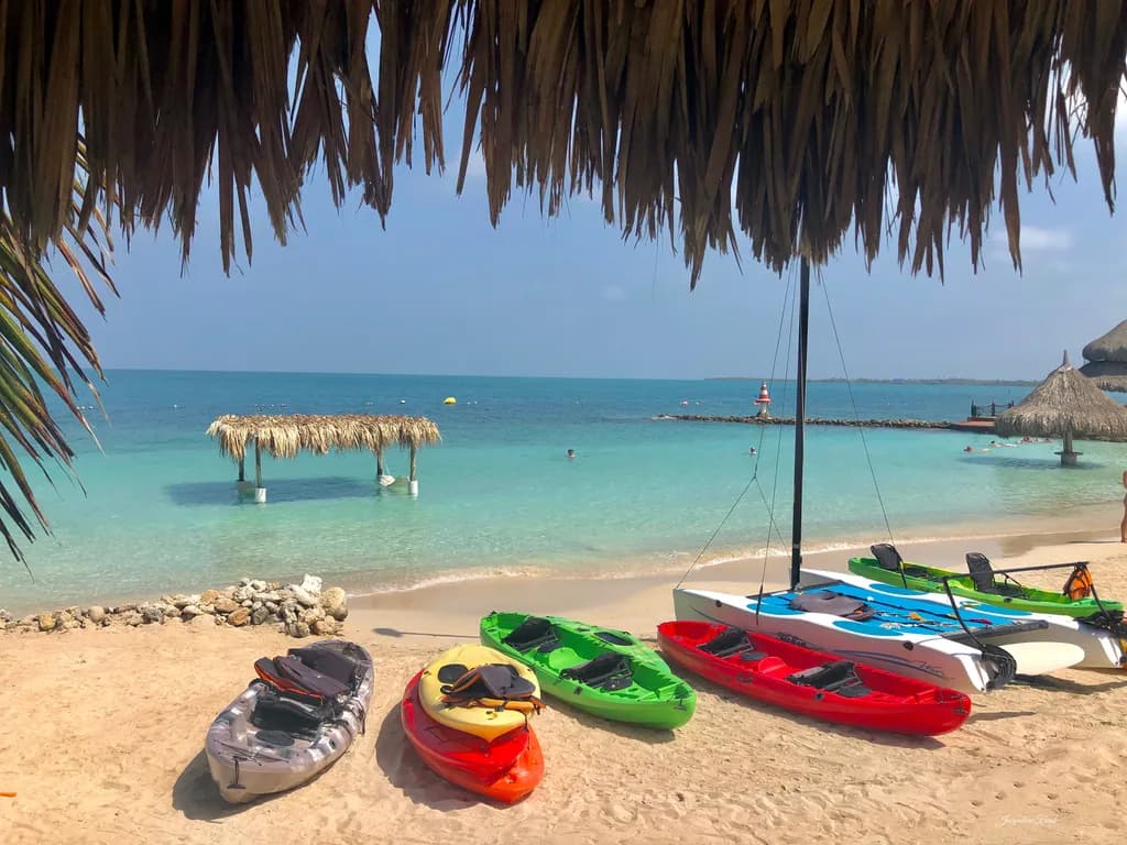Tropical Serenity: Kayaks Resting on a Sunlit Shoreline