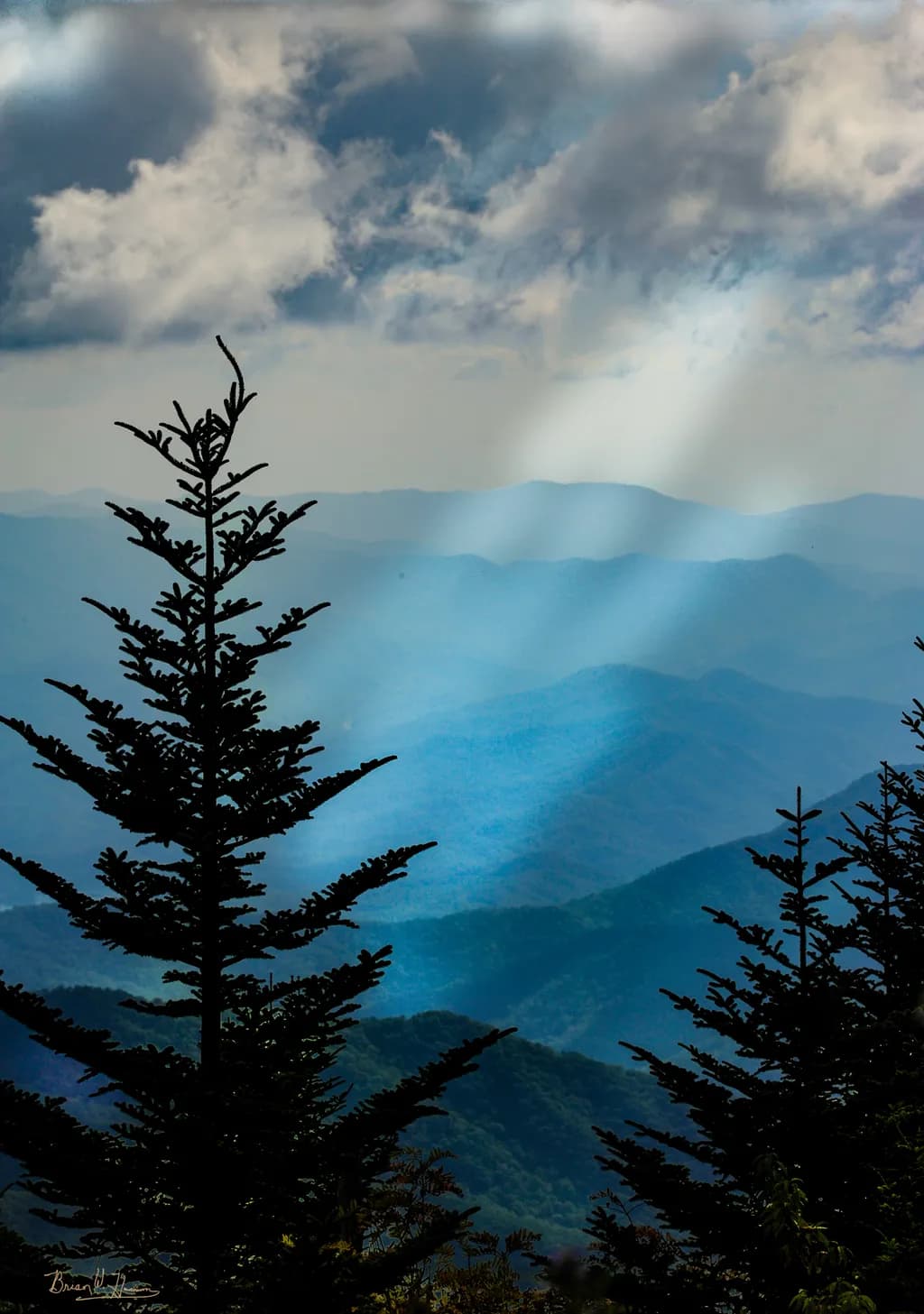 Whispers of Serenity: A Majestic Mountain Landscape with Trees and Clouds