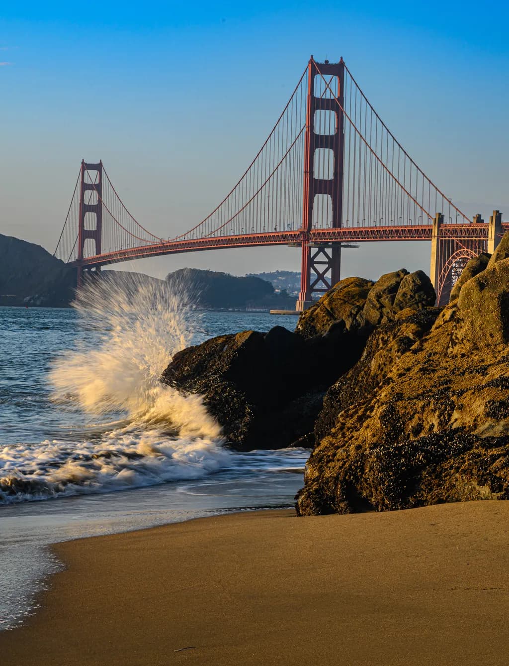 Golden Gate Serenity: Waves, Rocks, and the Embrace of Nature's Beauty
